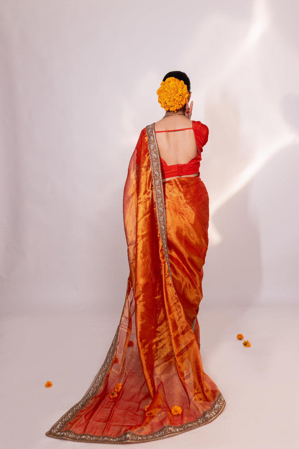 Taraash – Orange Tissue Saree with Zari Embroidered Border