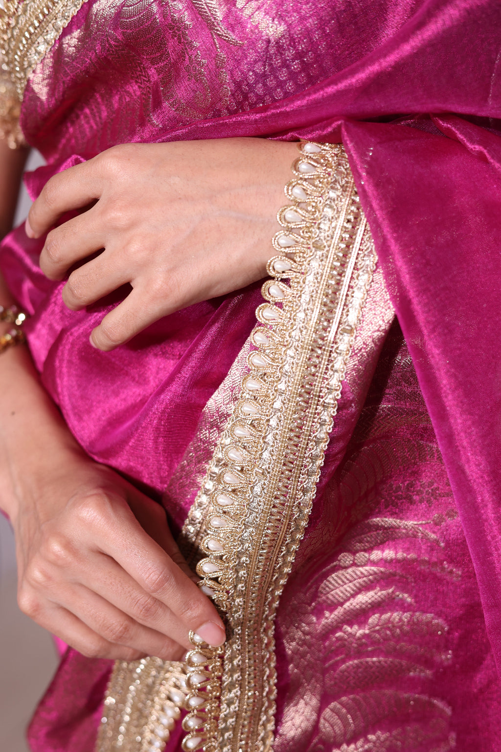Pari – A pink banarsi tissue silk saree with an elegant golden border and pallu.
