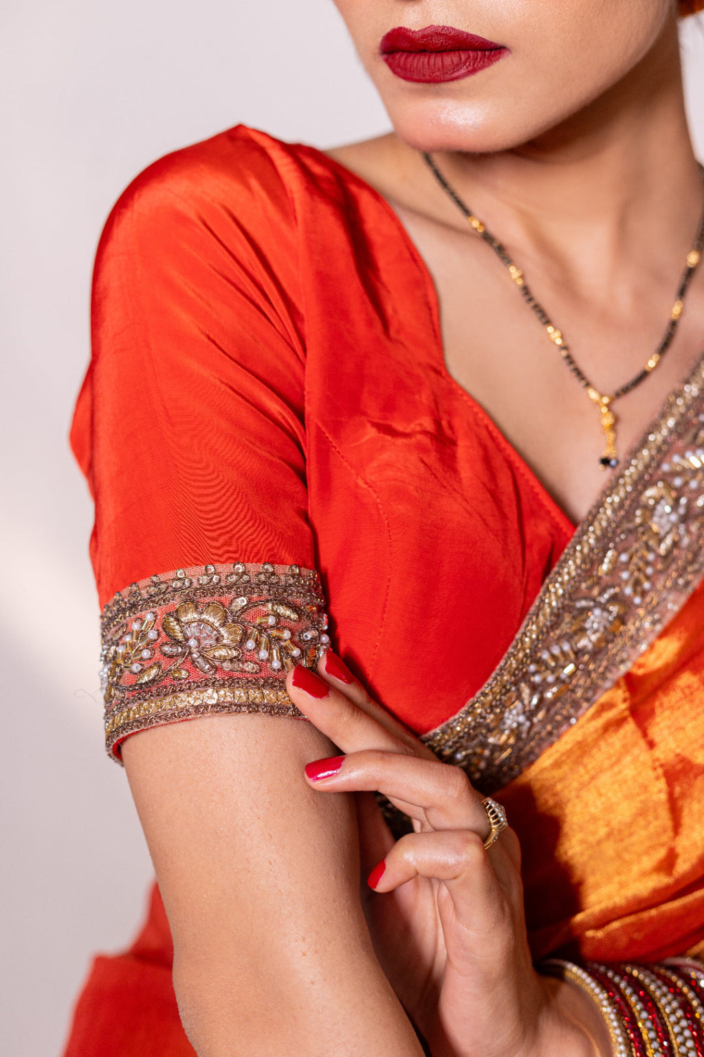Taraash – Orange Tissue Saree with Zari Embroidered Border