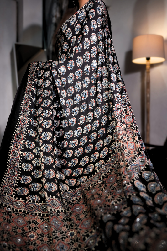 Sheesh Sultana - Jet Black Ajrakh Modal Silk Saree with Mirror Work  Product Description: