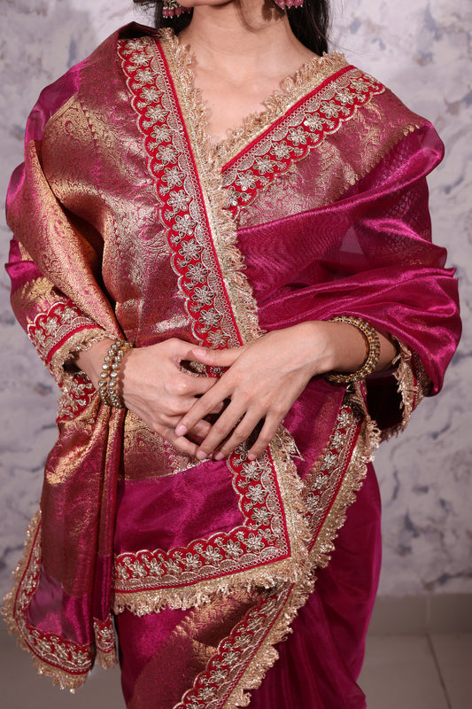 Rajasi – A majestic banarsi tissue silk saree in a rich fuchsia tone, with red-golden zari work