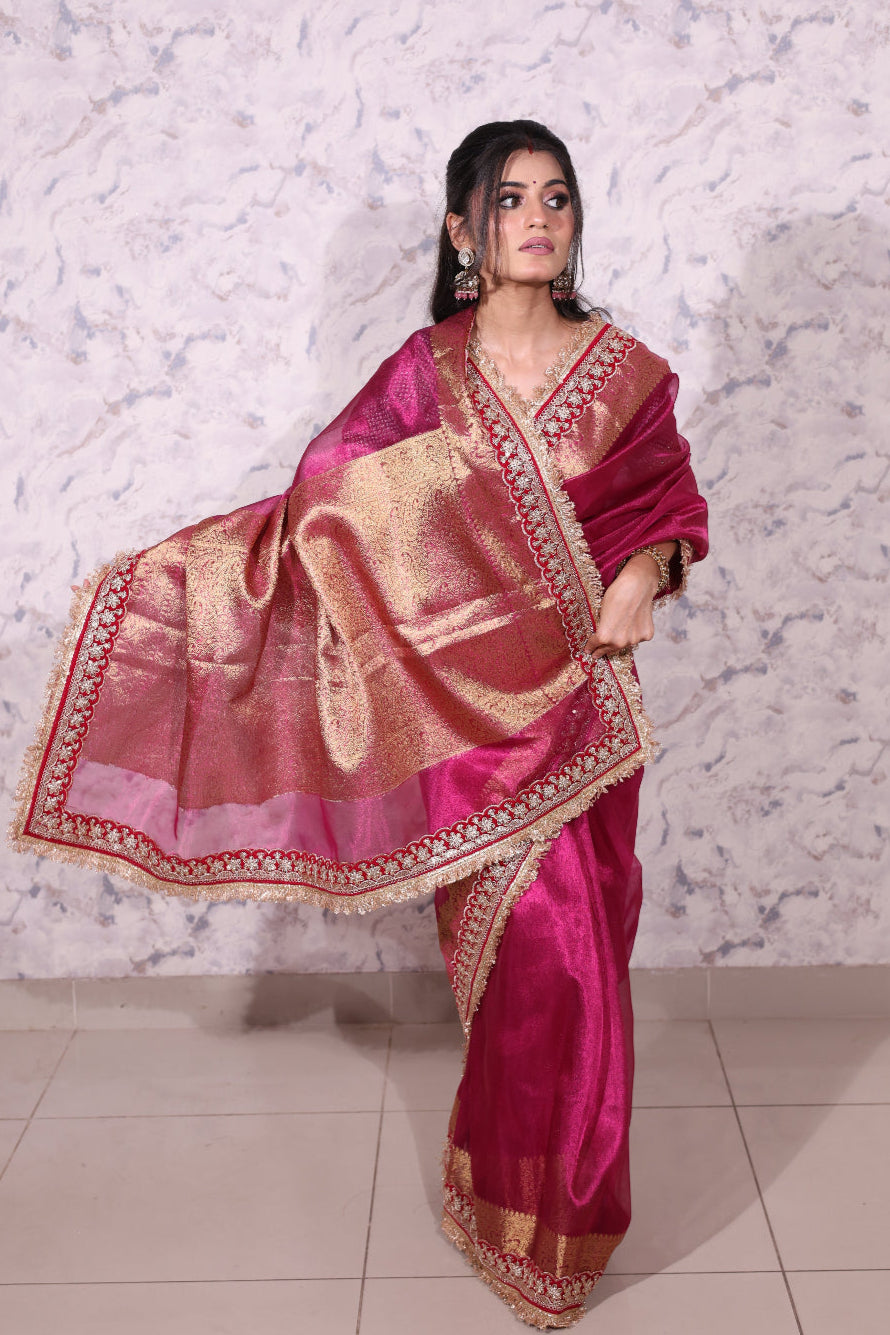 Rajasi – A majestic banarsi tissue silk saree in a rich fuchsia tone, with red-golden zari work