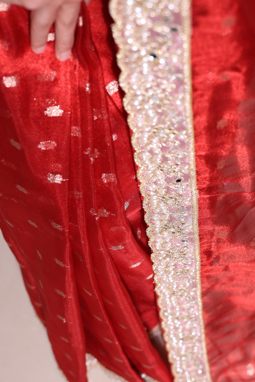 Shagun – A classic red banasri tissue saree with sparkling butis and a beautiful intricate border.
