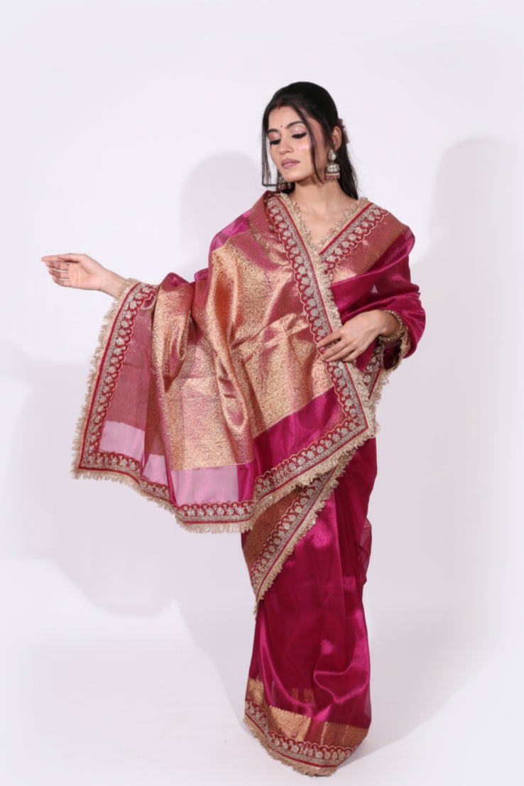 Rajasi – A majestic banarsi tissue silk saree in a rich fuchsia tone, with red-golden zari work
